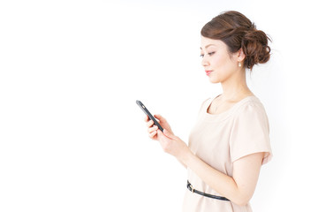 Fototapeta premium woman in dress using a smartphone