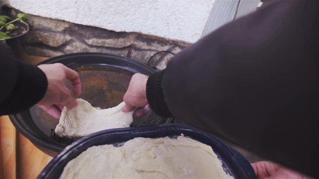 Frying dough in oil first person view 4K