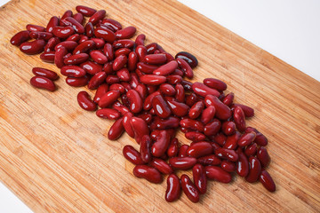 Red beans on a wooden background diagonally