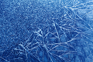 Ice flowers texture frozen blue window poster. macro view photography frost pattern. cold winter...