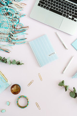 Flat lay home office desk. Women workspace with laptop on pale pink background. Top view feminine...