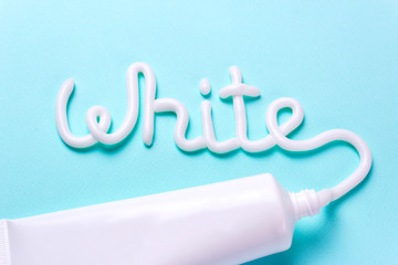 The word white is from the toothpaste. Tube for cleaning teeth and whitening