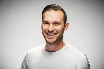 Attractive smiling man in a studio portrait.