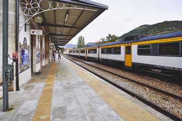 Railway station with an platform and a standing train in a small city. Pinhao city. Portugal.