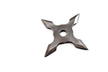 Four point throwing star stock photo images. Ninja star isolated on a white bacground stock images. Shuriken japanese concealed weapon © betka82