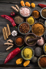 Variety of spices and herbs on kitchen table