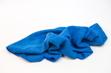Crumpled blue microfiber cloth isolated on white