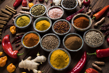 Variety of spices and herbs on kitchen table