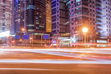 Blurred traffic light trails on road