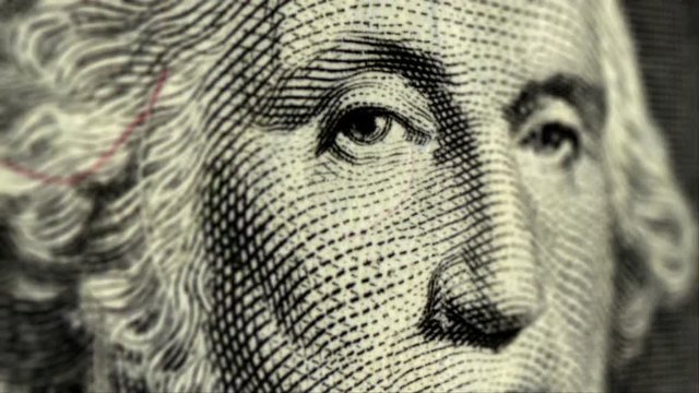 Cash 001: Presidents George Washington and Abraham Lincoln on one and five dollar bills (Loop).