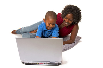 Family: Mother Teaching Boy To Use Laptop Computer