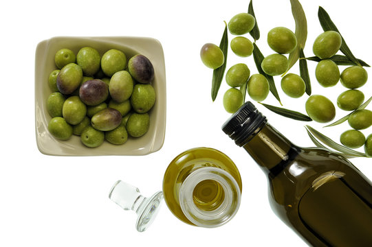Close up of a bowl of olive and extra virgin olive oil in bottle