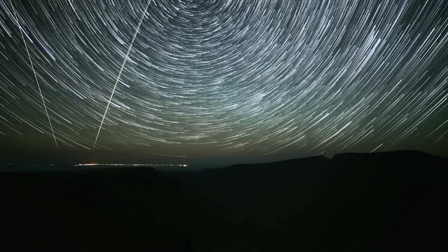 North Star over Kiger Gorge on Steens Mountain with City of Burns in Distance Abstract Star Trails Night Time Lapse