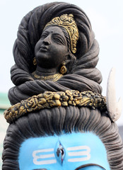 Statue of Hindu God Shiva with Third Eye and Ganga river,depicted as female form, flowing out of head, as in mythology