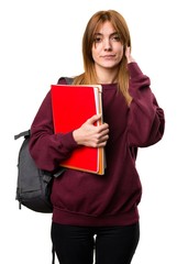 Student woman covering her ears