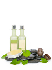 Cosmetic products arranged with zen stones