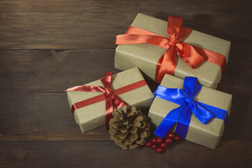 Packaged gifts tied with red and blue ribbons, lump and viburnum