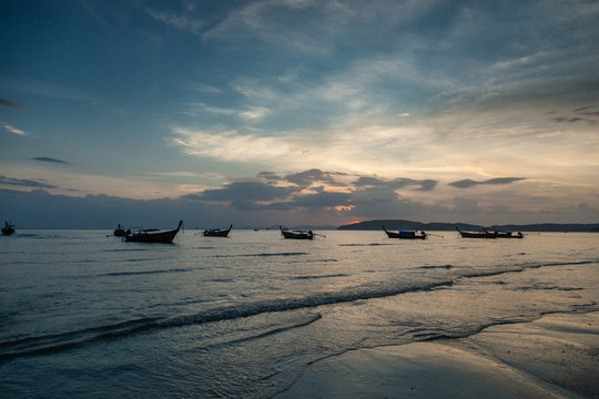 Ao Nang, Krabi province.Traditional thai boats at sunset beach.
