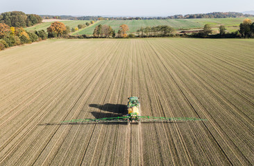 aerial view of the tractor on the harvest field