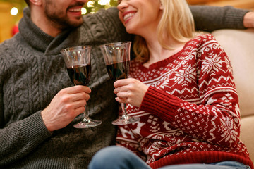 Christmas toast with glasses of wine at night, concept