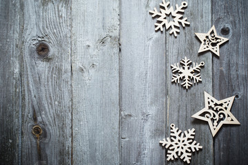wooden snowflakes and srars on old dark background