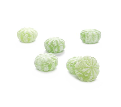 Green menthol candies isolated on white background