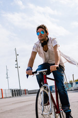 man rides a fixie bicycle in barcelona