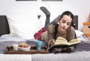 Woman enjoying book in morning time