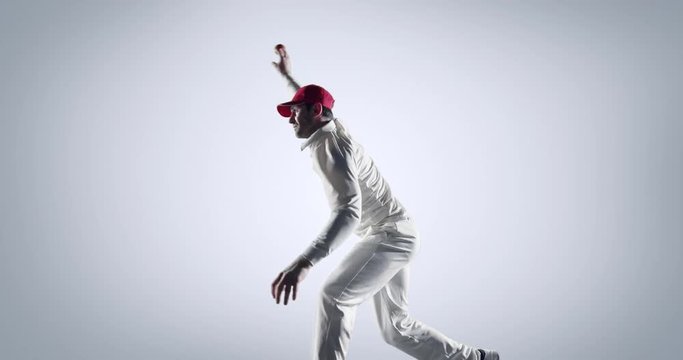 Cricket player in action on white background