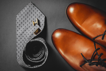 Accessories for mens. Brown shoes with tie and cuff