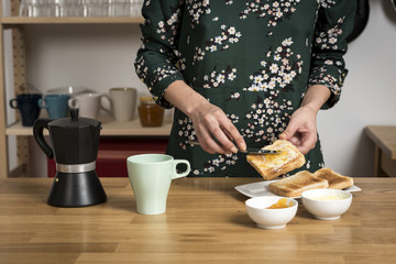 Woman smearing honey on toast