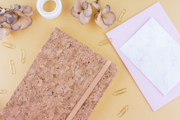 Top view image of notebook with with pen.