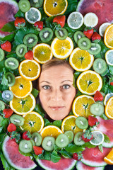 Fruits and blond cute woman portrait