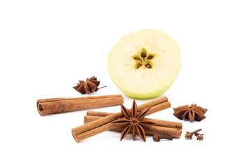 Aromatic apple, star anise, cloves and cinnamon isolated on white background