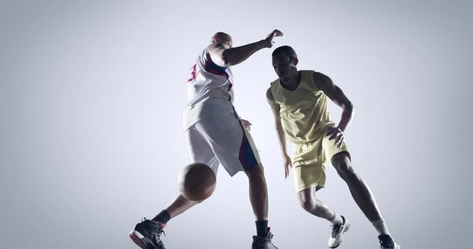 Basketball players in action on white background