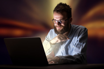 Businessman in the office at night