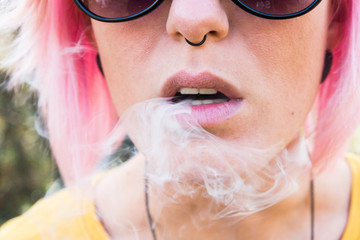 Face girl closeup, smoke from her mouth / Smoke out her mouth gently drops , with fuchsia hair