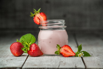 Strawberry yogurt in a glass jar
