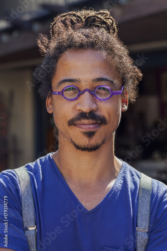 Serious Mixed Race Man Wearing Suspenders Stock Photo And Royalty