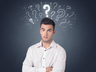 Businessman with question marks