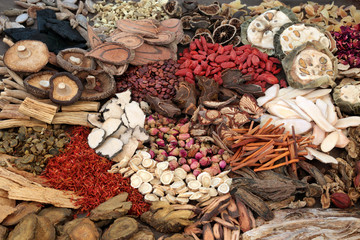 Traditional chinese herbs used in herbal medicine forming a background.