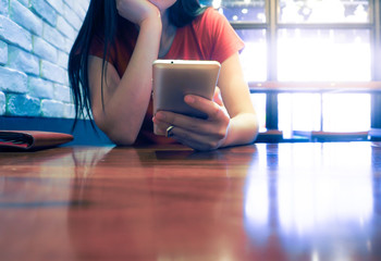 Woman is playing smartphone in Japanese resturant during lunch time
