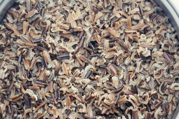A pot with steamed black rice close-up