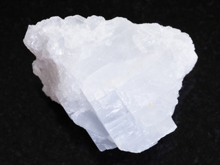 rough crystalline Magnesite stone on dark