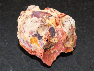 raw Bauxite (aluminium ore) stone on dark