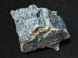 raw chrysotile asbestos stone on dark