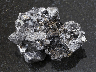 rough crystalline Magnetite stone on dark
