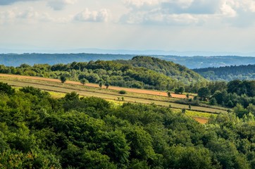 Fototapeta na wymiar Summer hills landscape. Beautiful green Jurassic hills in Poland.