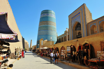 Khiva: people in the street of old town - obrazy, fototapety, plakaty