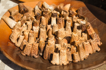 Cats are handmade of clay. Many cats on the big dish. The traditional Belarusian Souvenirs ceramic. Mascot.